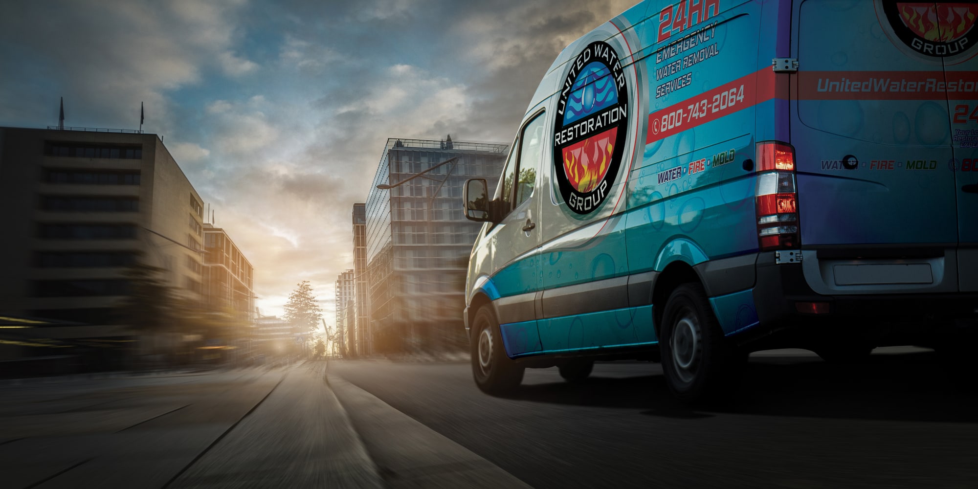A United Water Restoration Group of Missouri City van heading out on an emergency call at sunset