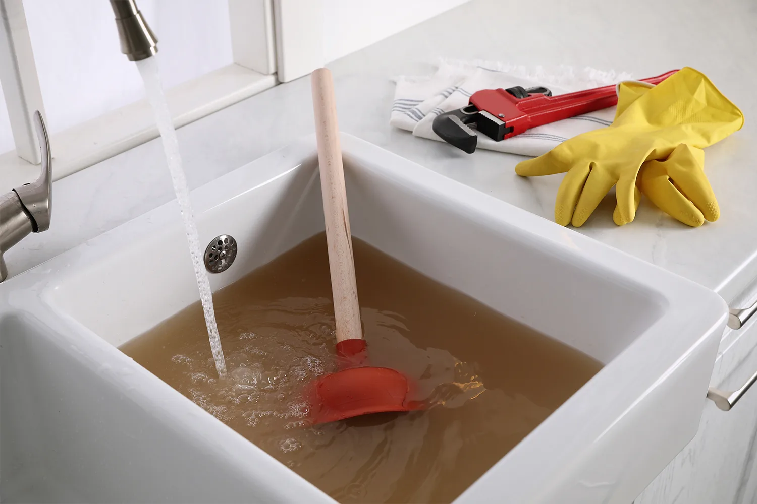 A slow-draining sink backing up with standing water